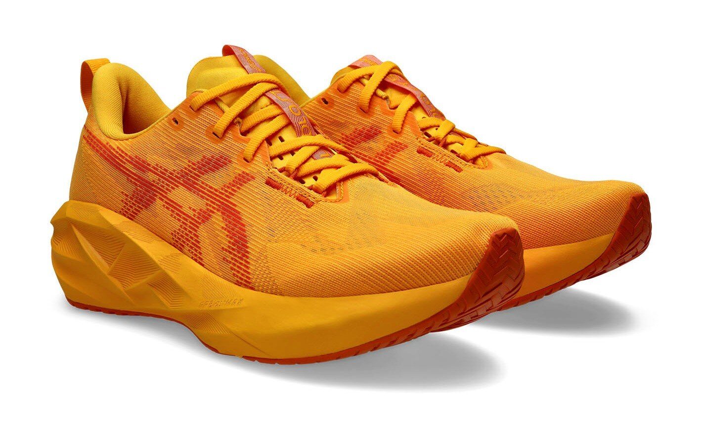 A pair of ASICS Novablast 5 running shoes in the all-orange Yamabuki/Anzu colourway