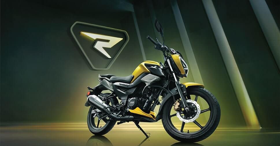 Side profile of the yellow and black TVS Raider in a studio setting